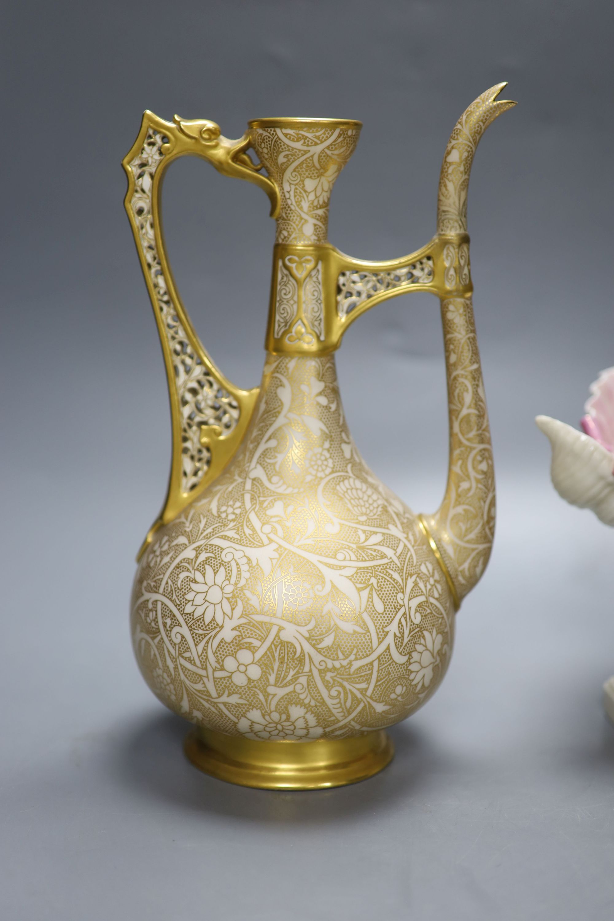 A Royal Worcester ewer, in the Persian style, a shell and dolphin centrepiece and a vase, tallest 30cm